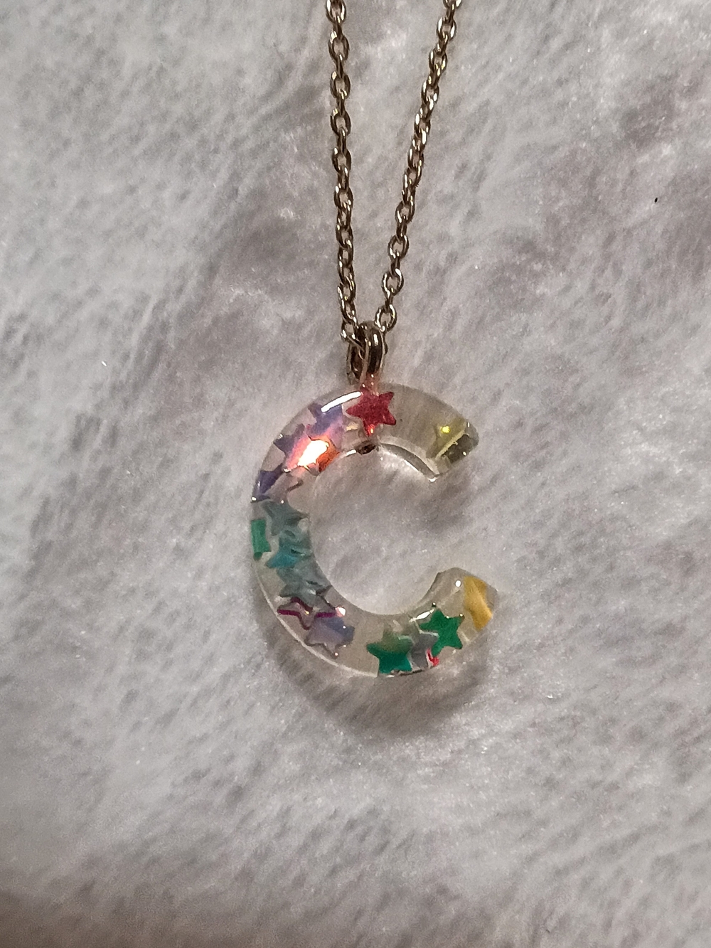 Clear Resin 'C' Bunnle Pendant Necklace with Multicolor Star Accents
